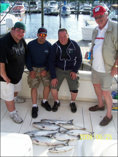 group of 4 with their fishing charter catches