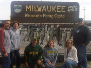 group in front of their charter fishing haul