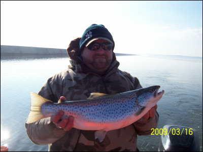 man holding a milwaukee brown trout