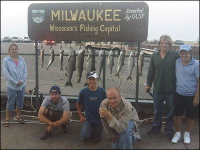 group of 6 standing in front of their fish