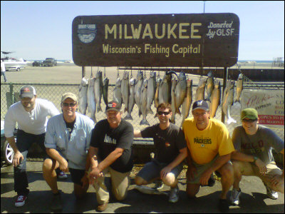 Group of 6 posing in front of their haul