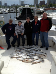 group of 5 with their cohos catch