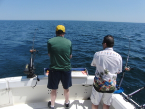 2 men fishing on boat